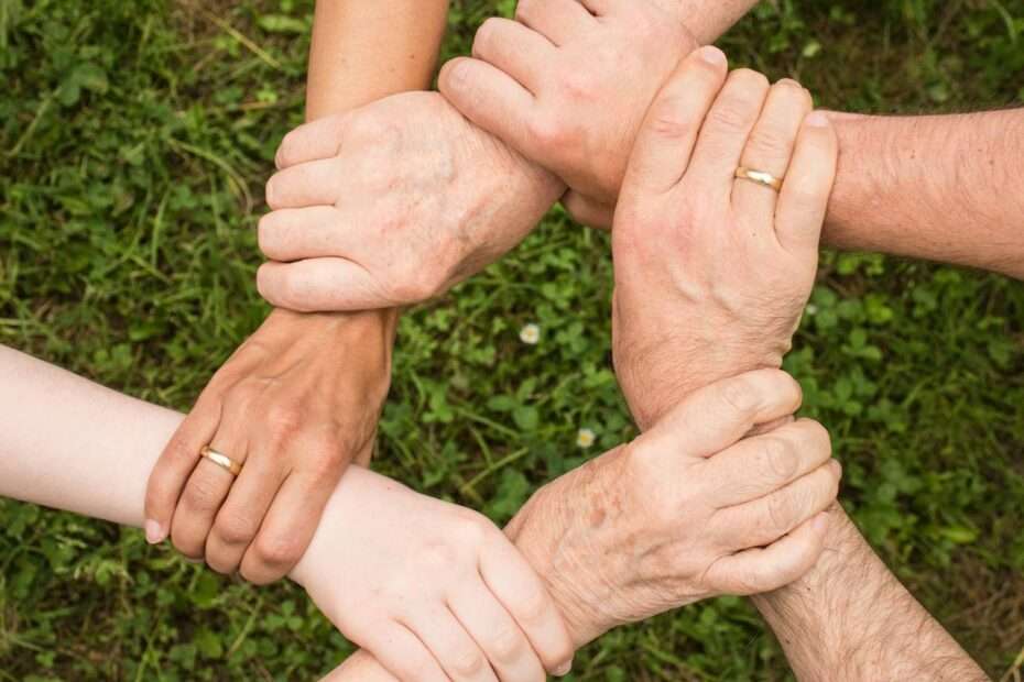 Group of People Holding Arms